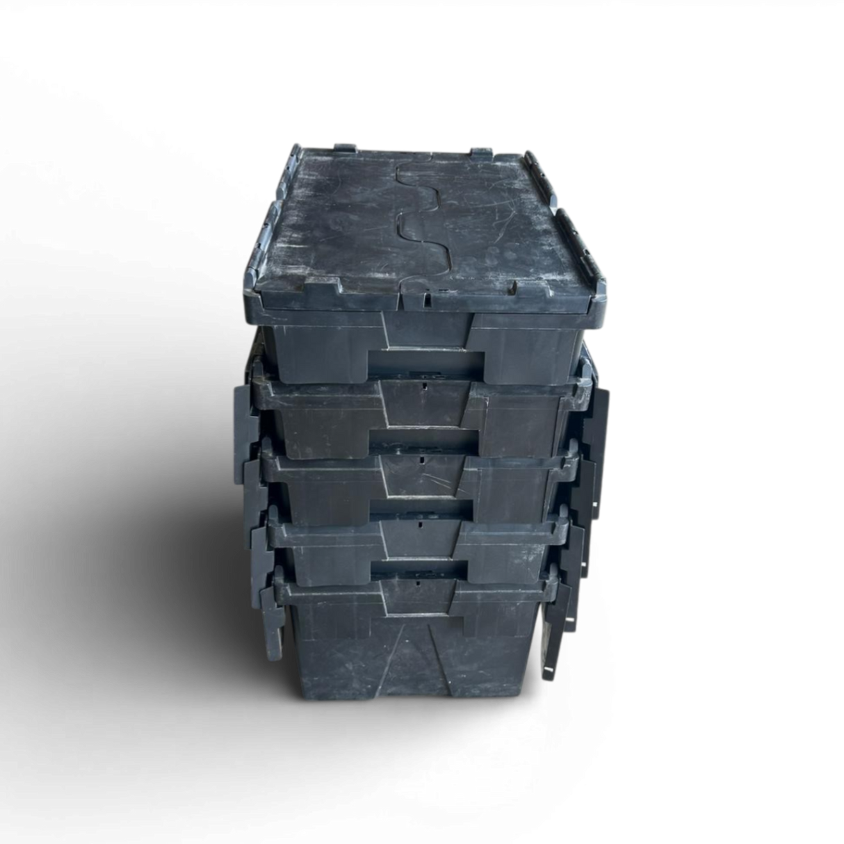 Stack of black plastic crates on a white background