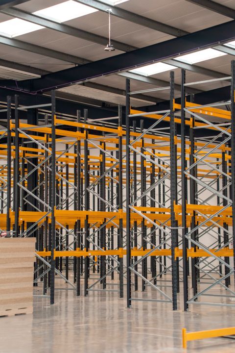 Bays of Link 51 pallet racking with yellow beams installed in a warehouse
