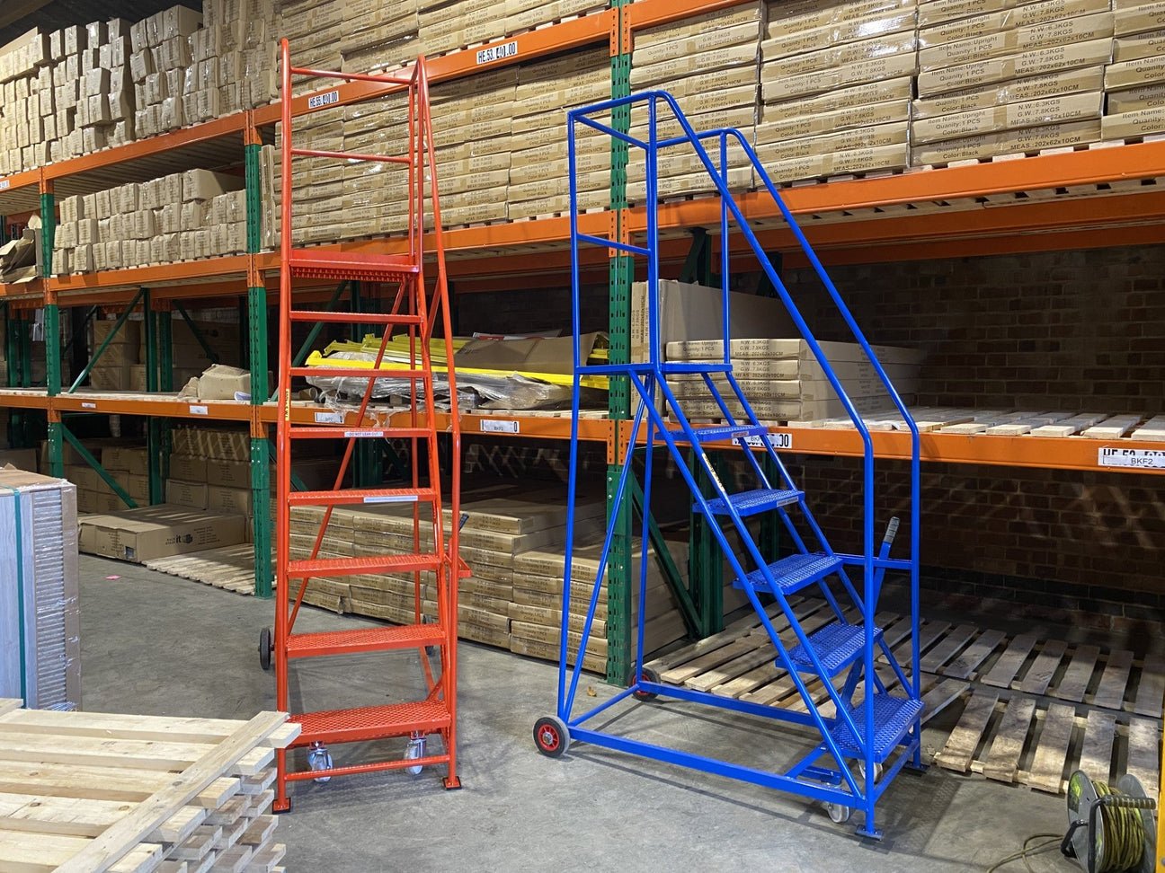 Warehouse steps in a warehouse, orange ones to the left and blue to the right