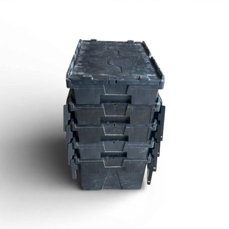 Stack of black plastic crates on a white background
