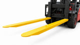 Forklift fitted with heavy duty fork extensions