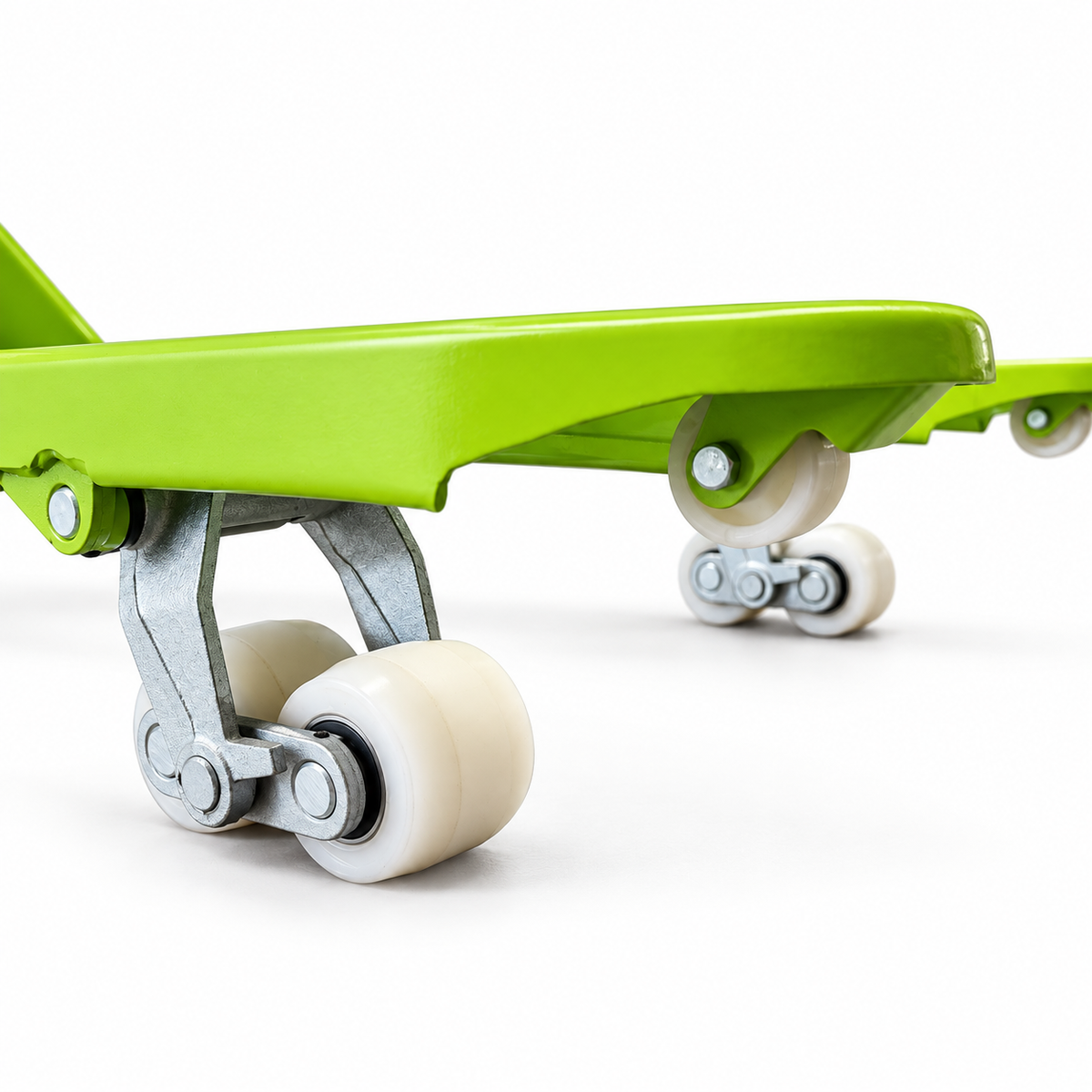 Entry guide roller in the tip of the lime green fork, with the tandem load rollers behind it