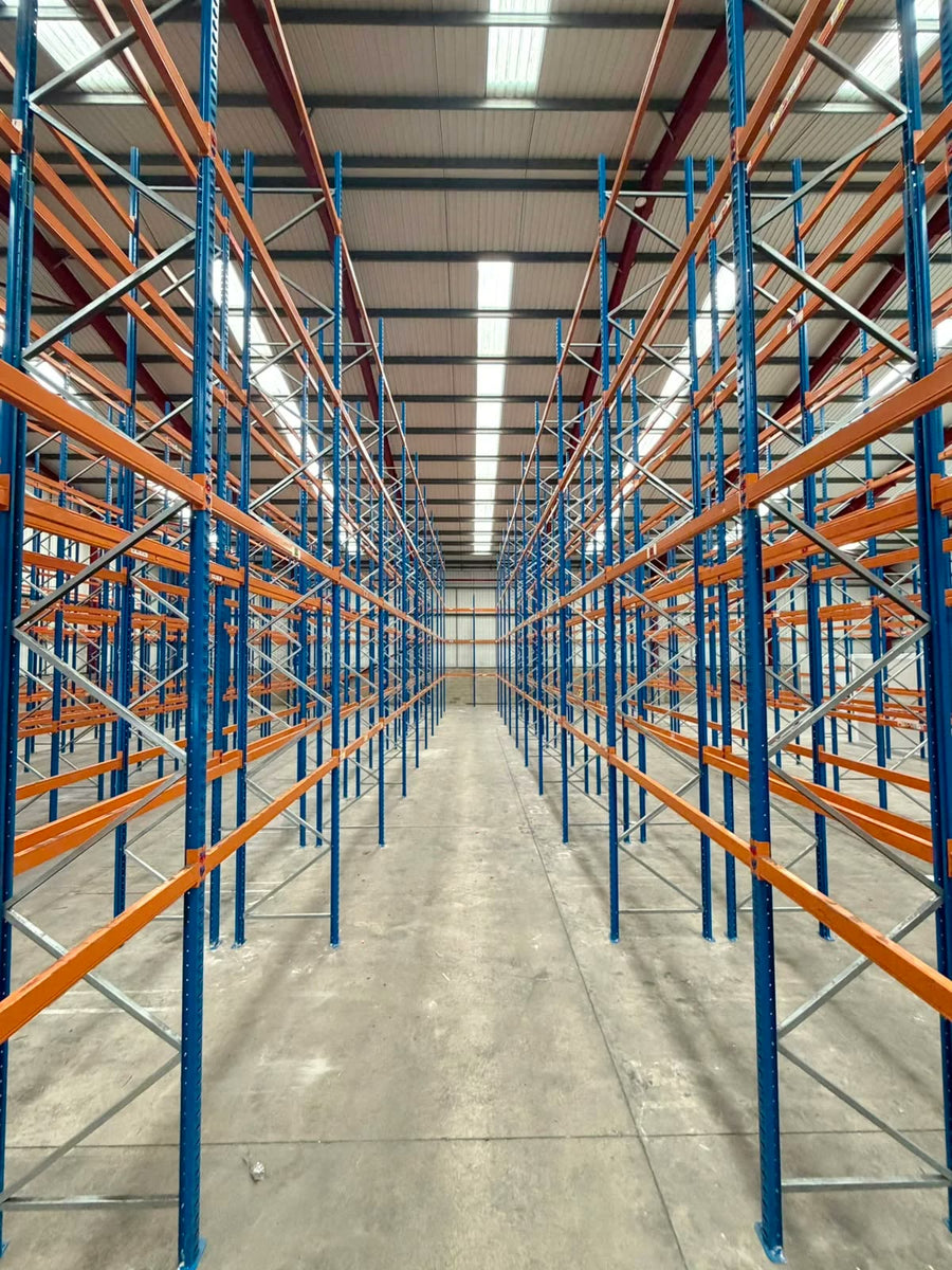 Long runs of Apex pallet racking installed by Rack It Stack It in a Sheffield wholesale warehouse