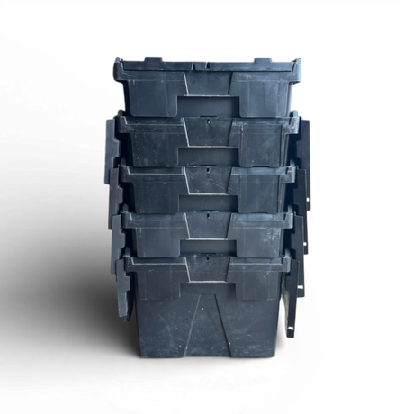Stack of black plastic storage bins on a white background