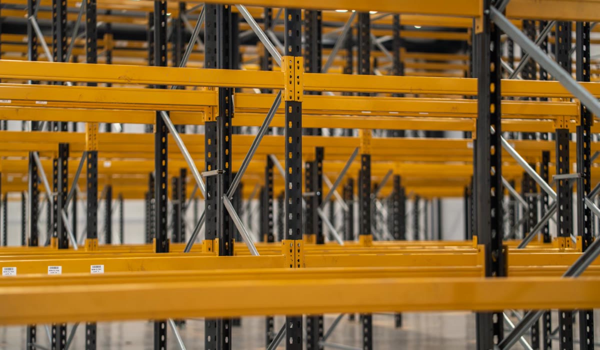 Yellow pallet racking beams and uprights close up, ready for inspection and repair